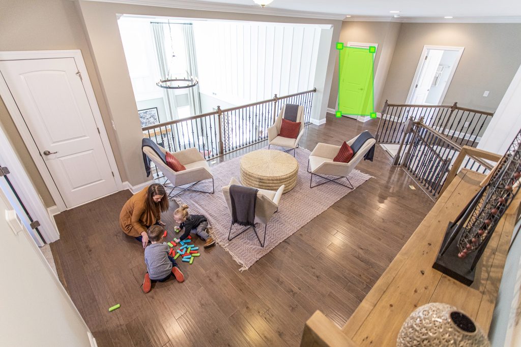 Security Camera footage showing mom playing with kids inside