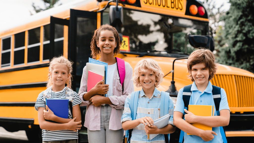 Kids in front of school bus