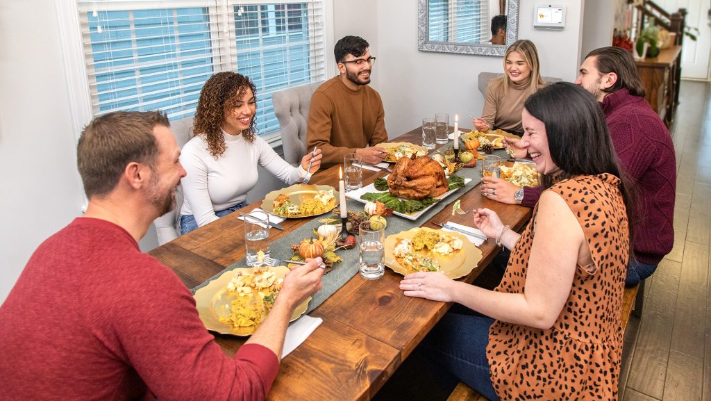 Friends eating Thanksgiving Dinner