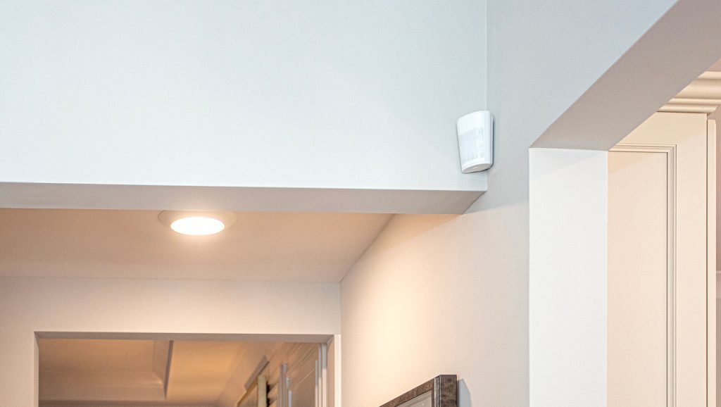 CPI Security motion sensor mounted on living room wall