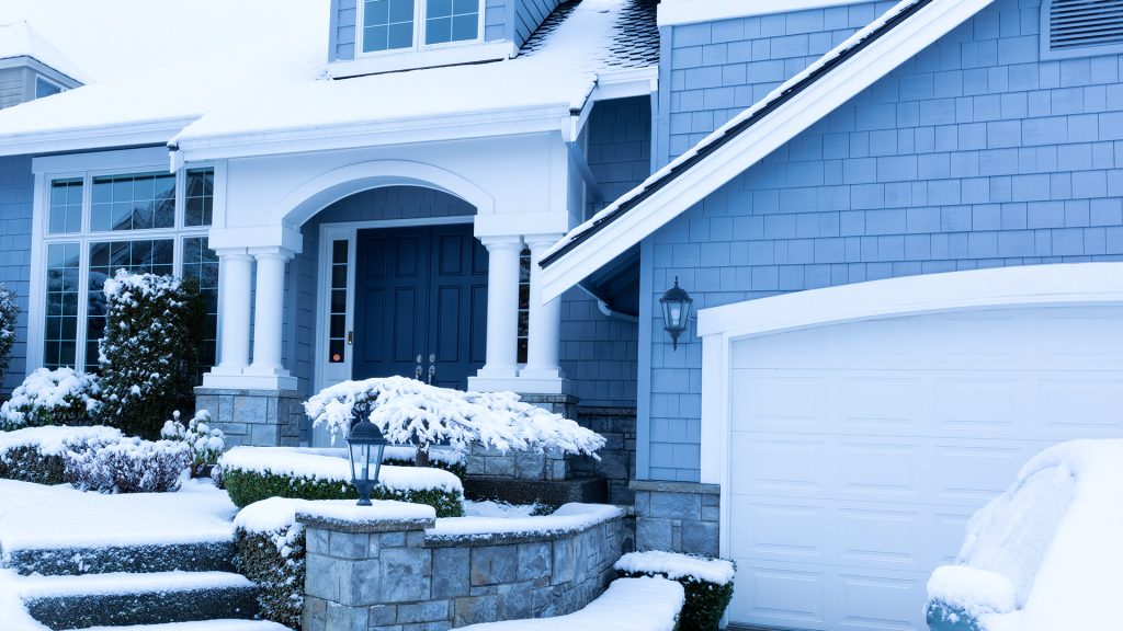 Front of house covered in snow