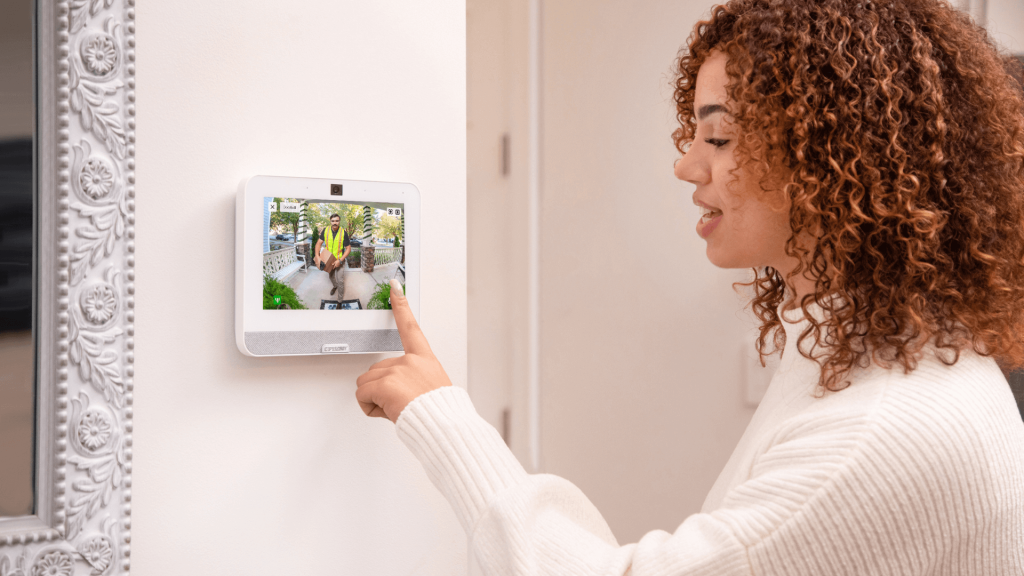 Trends 2024 Women talking to delivery driver through CPI Security SmartHub