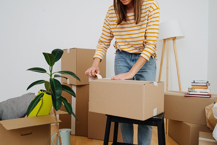 Woman packing boxes