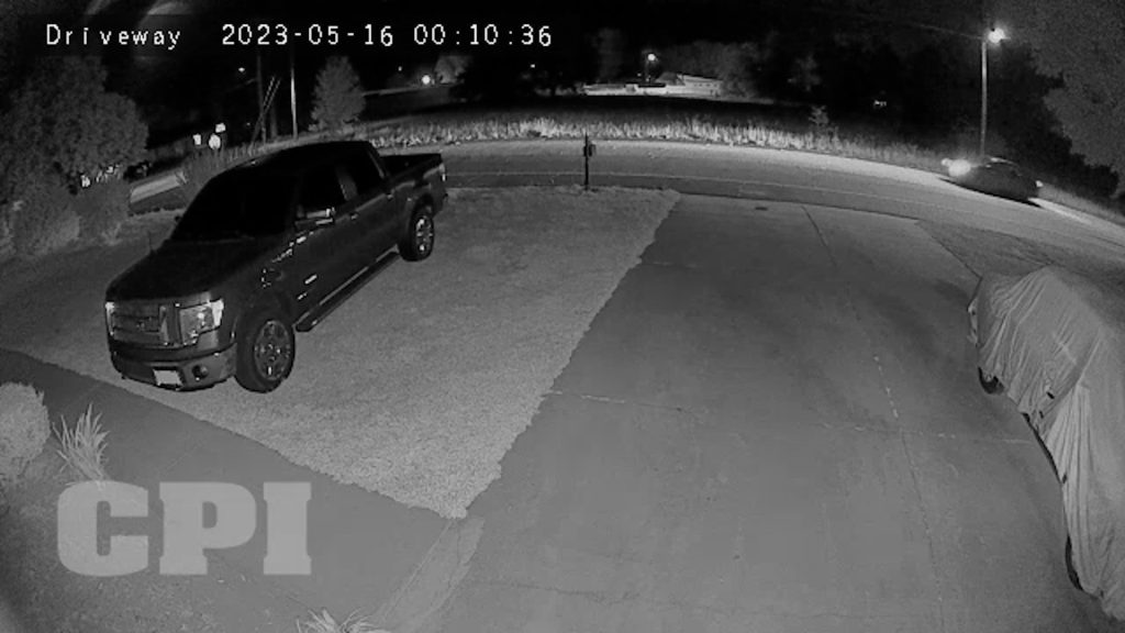 Outdoor security footage showing front driveway of home