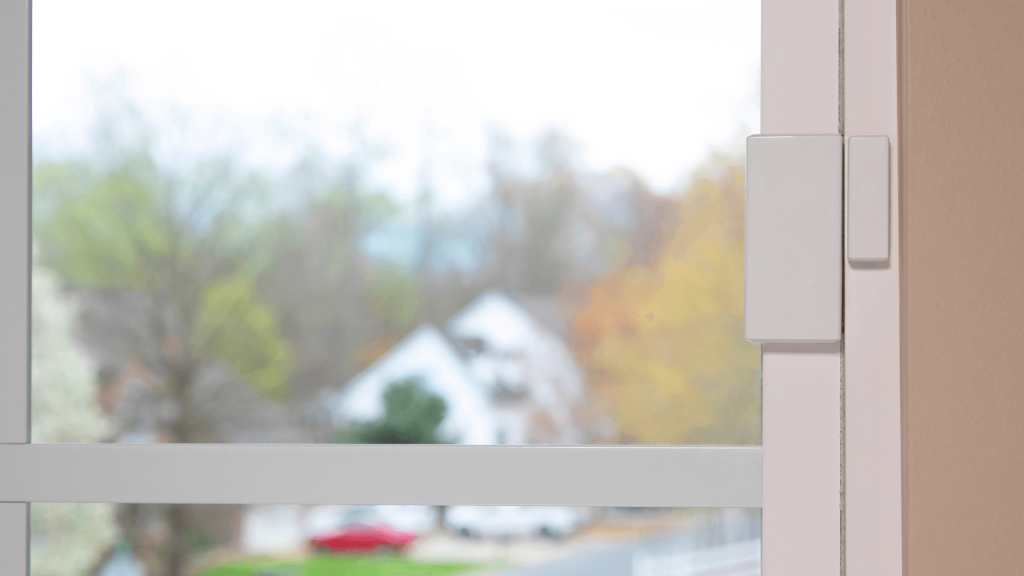 CPI Security door and window sensor mounted on window