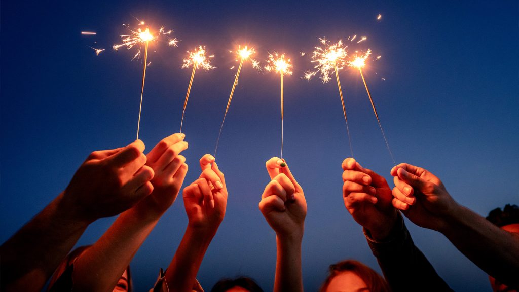 People holding sparklers