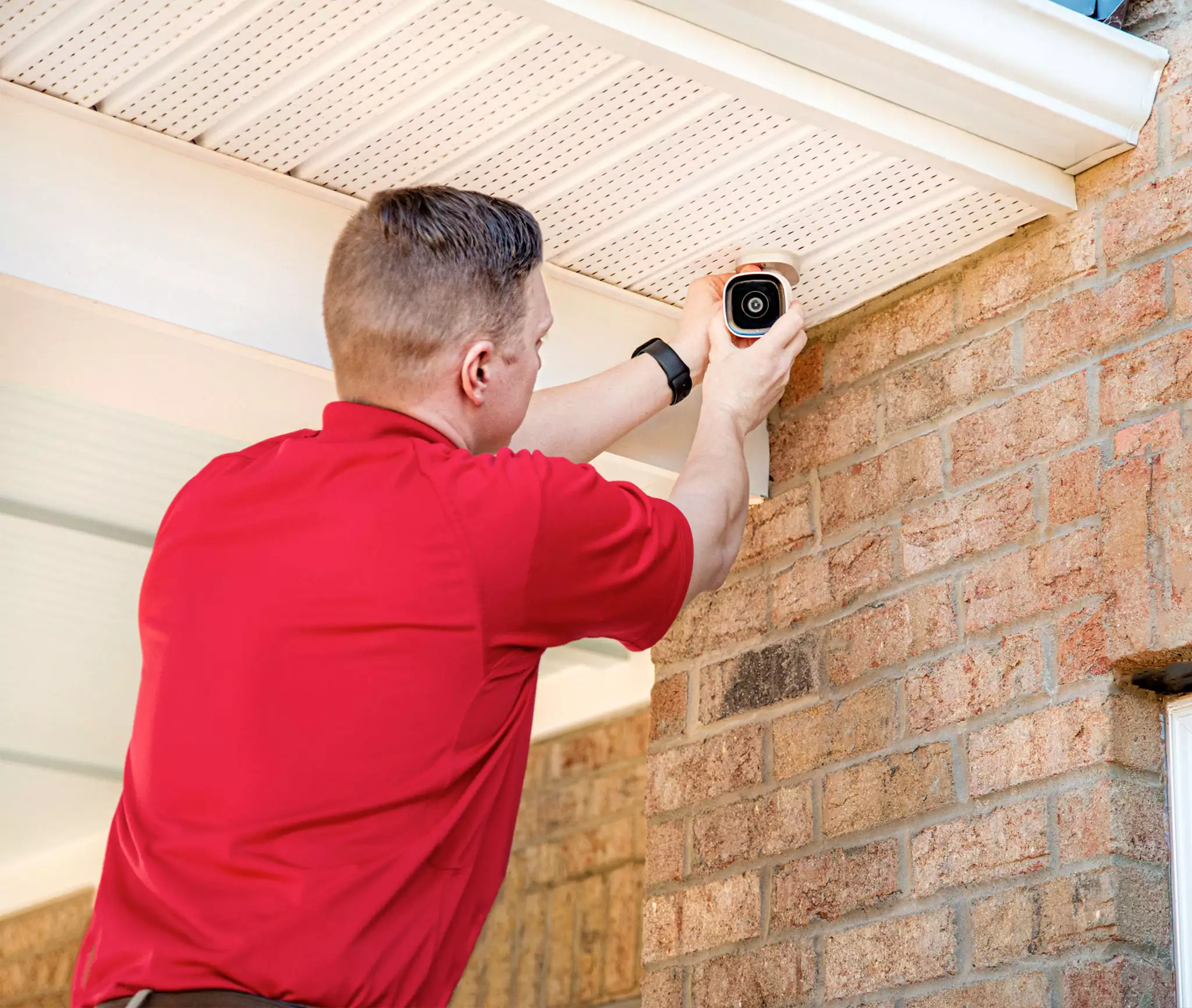 CPI Security Technician Installing Outdoor Camera