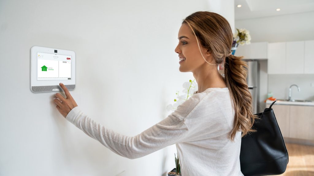 Woman interacting with CPI Security SmartHub Panel