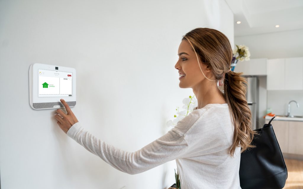 Woman looking at CPI Security SmartHub Panel