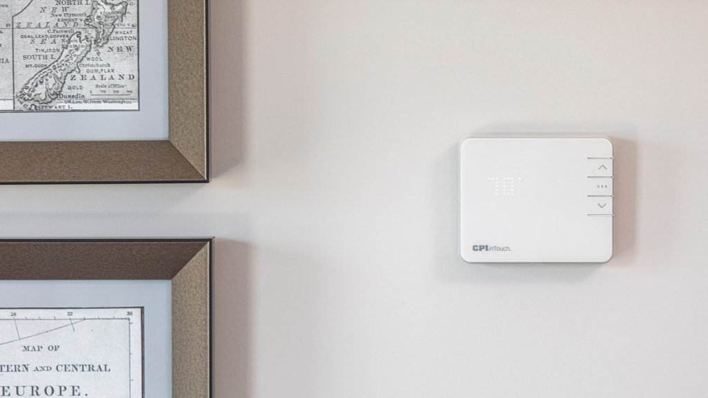 CPI Security smart thermostat mounted on wall