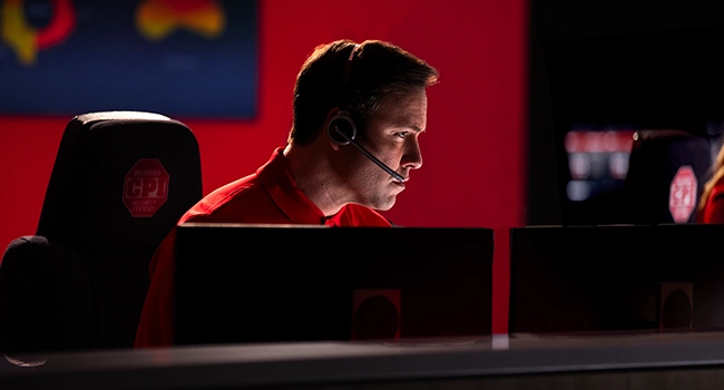 CPI Security monitoring agent wearing a headset at the central station