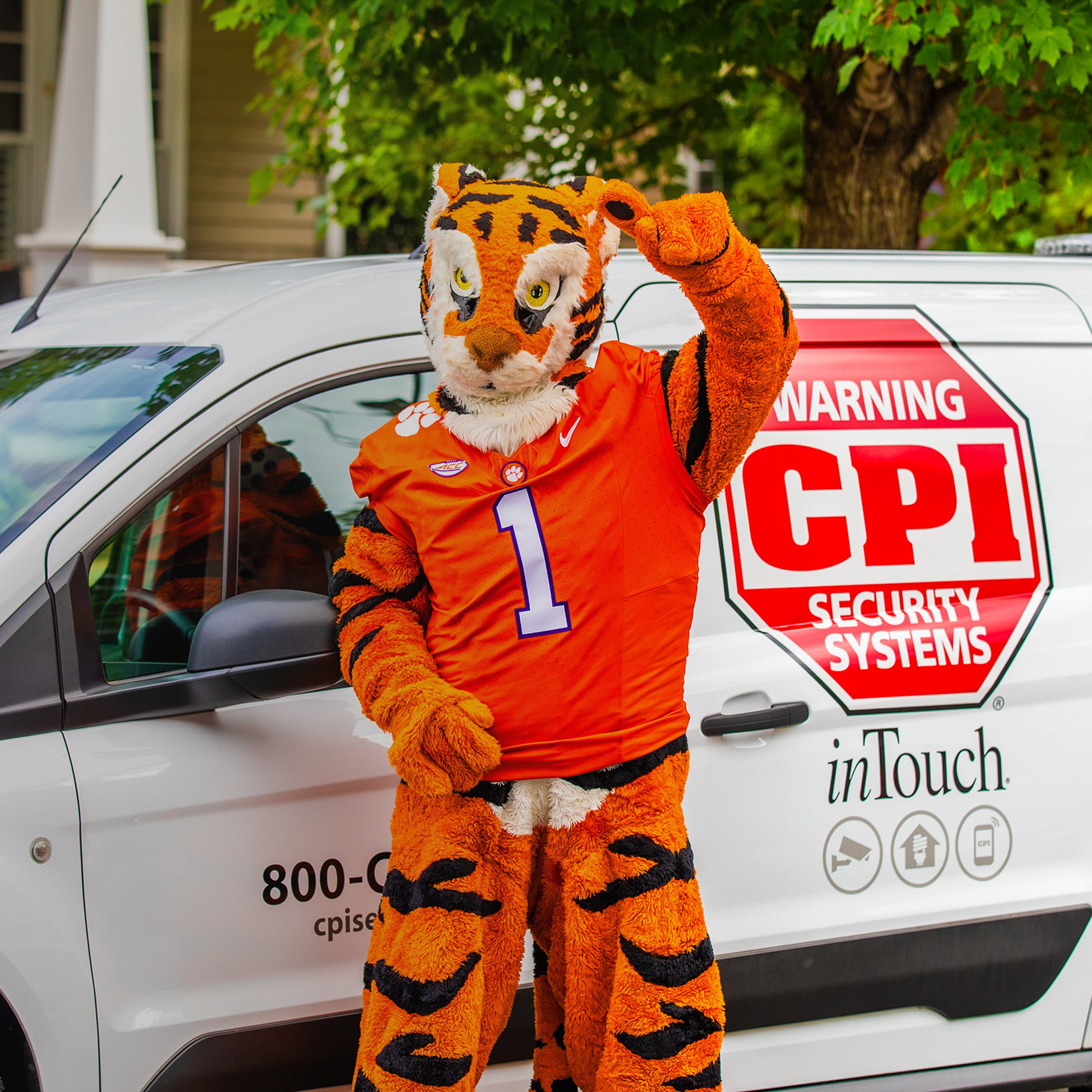 Clemson mascot standing in front of CPI van