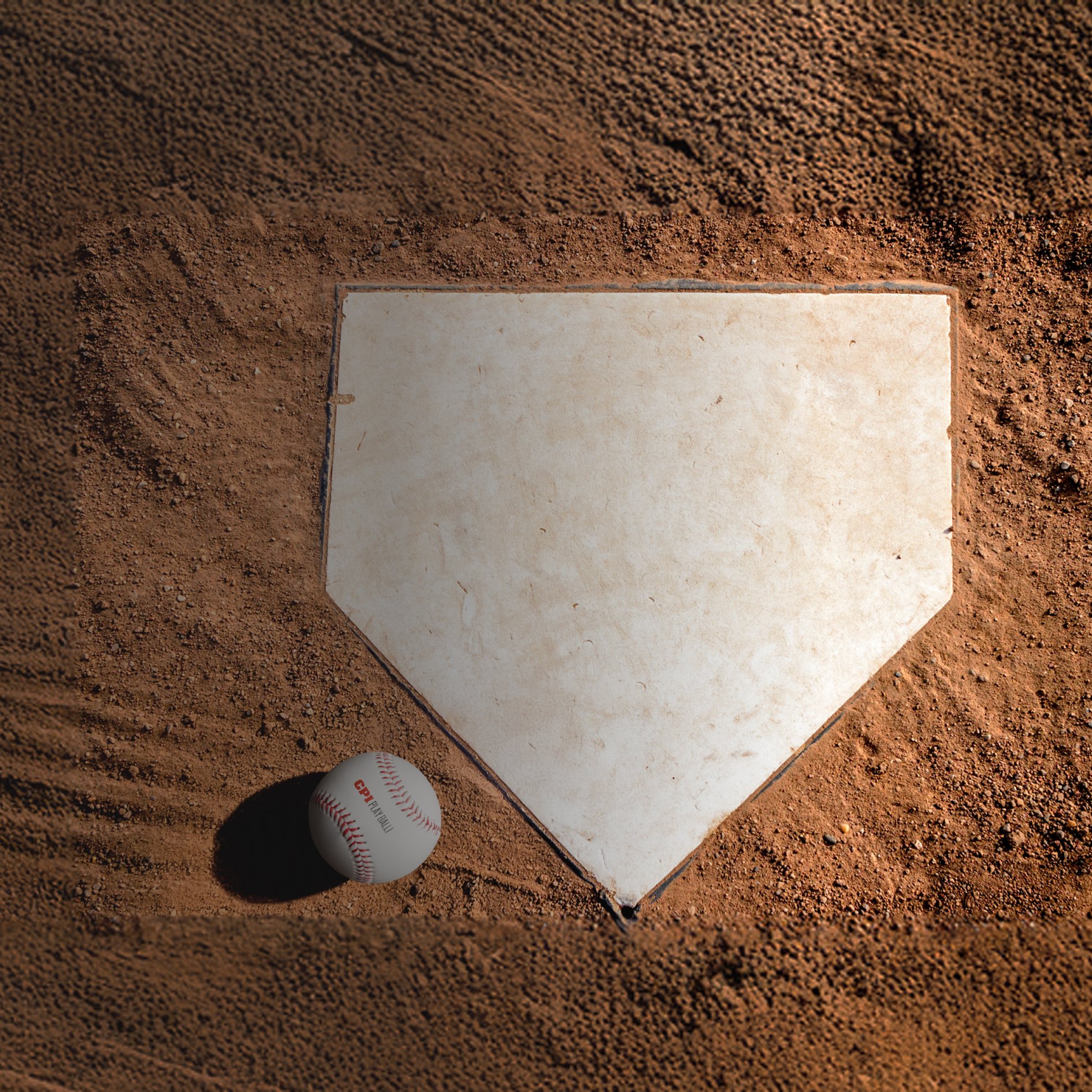 Baseball home plate with baseball in dirt