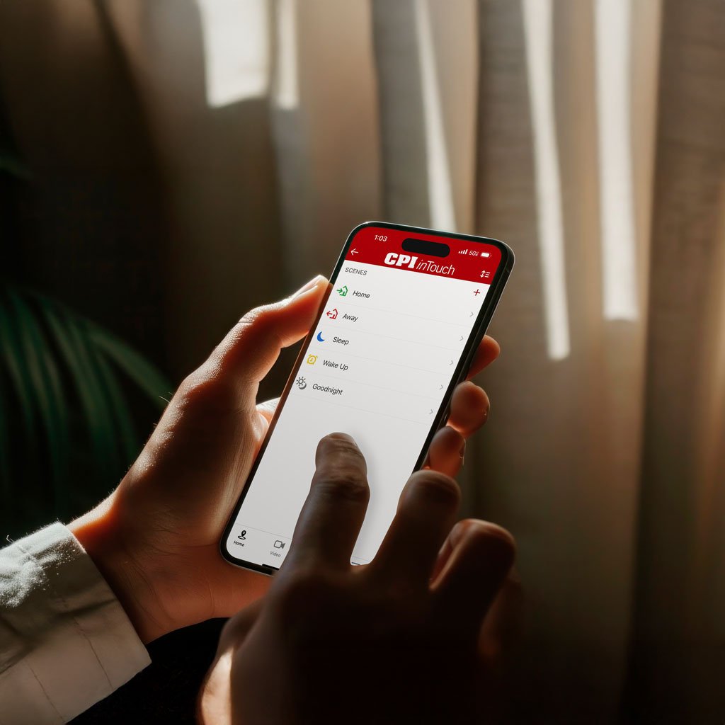 Person using the CPI inTouch mobile security app on a smartphone