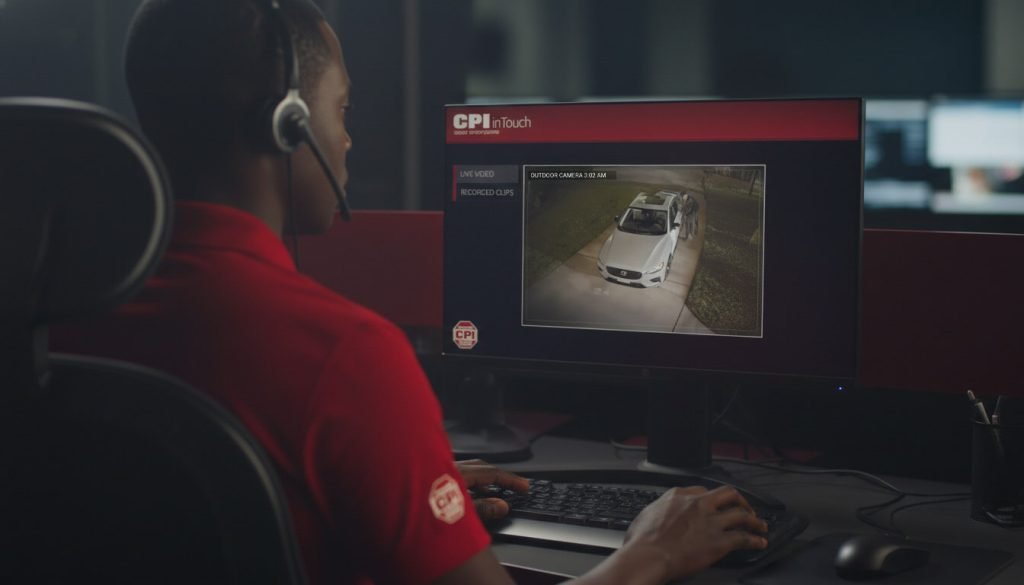 CPI Security monitoring center operator performing alarm video verification on a live outdoor security camera feed