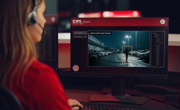CPI Security agent looking at screen at monitoring station