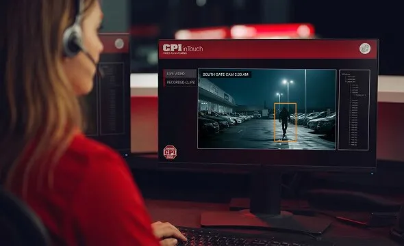 CPI Security agent looking at screen at monitoring station