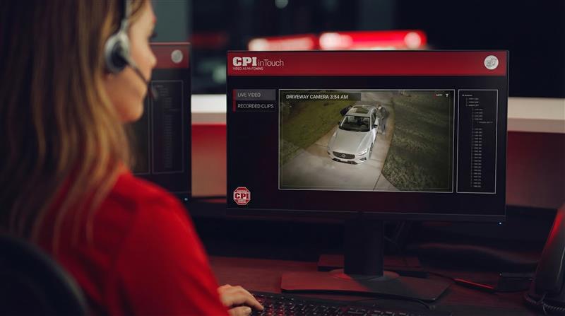 Central station monitors security camera footage of residential driveway